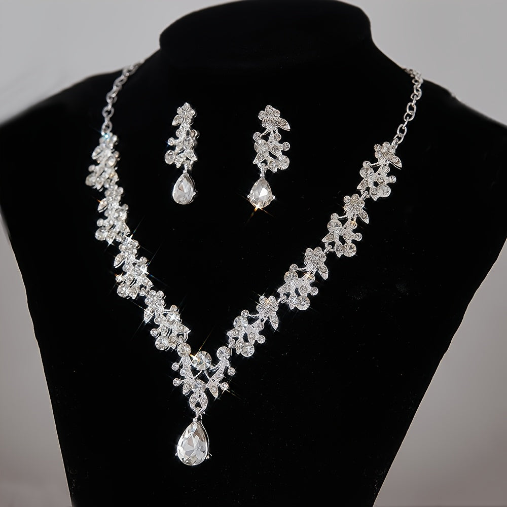 Céleste zircon bridal necklace and teardrop earrings on a black bust