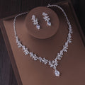 Céleste bridal set: zircon leaf necklace with teardrop centre and matching drop earrings on a display
