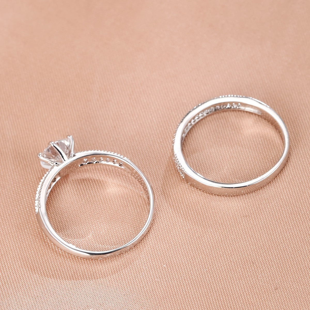 Éternité ring set showing the solitaire setting and slim band from the side