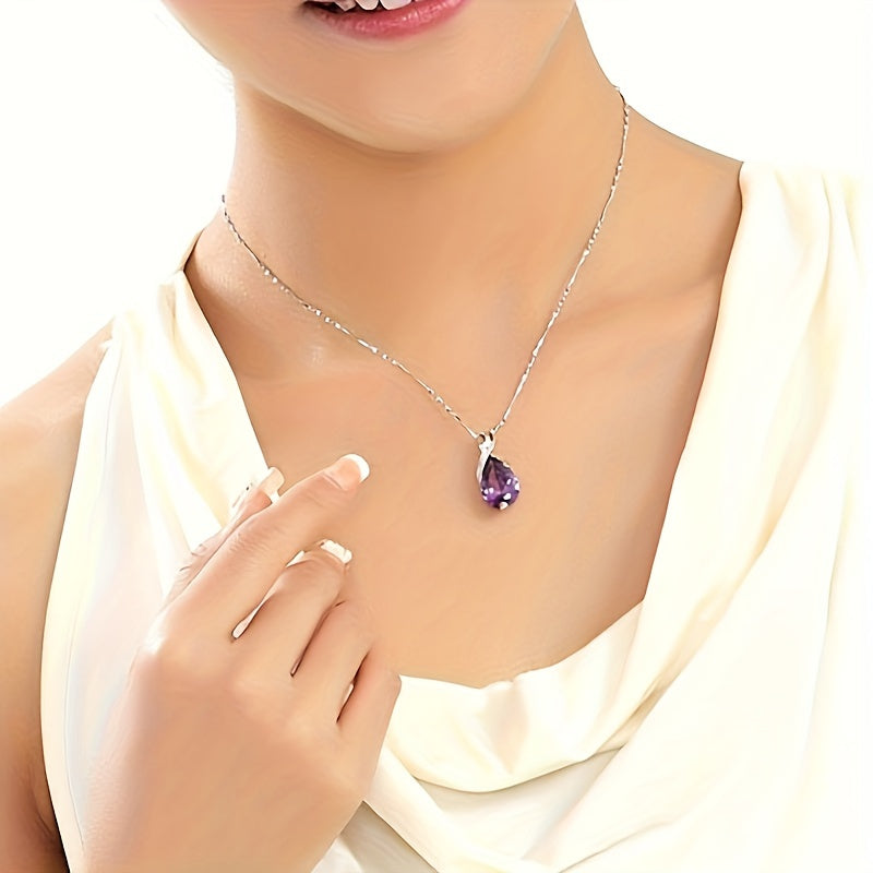 Violet Drop pendant necklace worn with a cream top