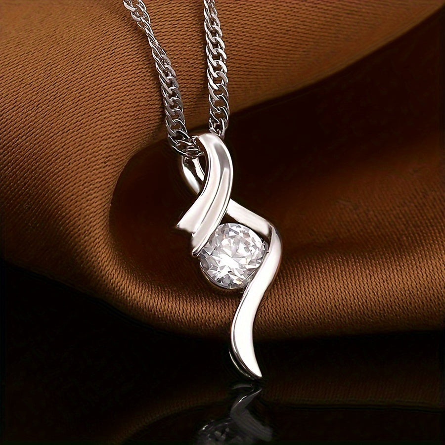 Ondine silver-tone ribbon pendant with zirconia on dark satin