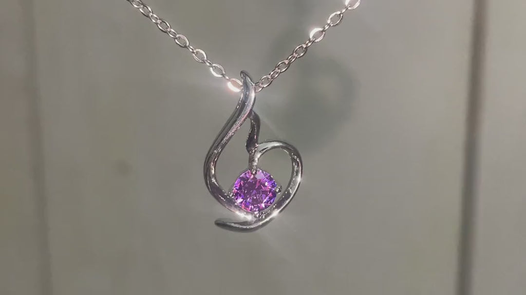 Lumière Violet Heart Pendant turning in daylight – short video
