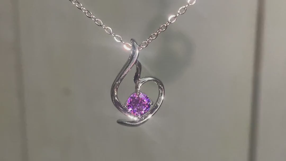 Lumière Violet Heart Pendant turning in daylight – short video