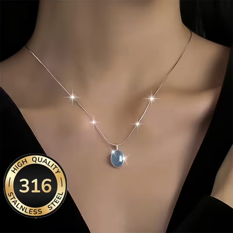 Silver Prism necklace: blue oval stone on a fine silver-tone chain, worn