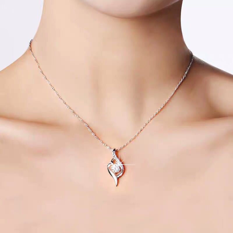 Twist of Heart pendant necklace worn